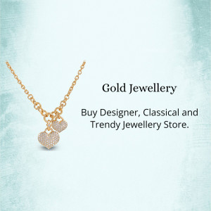 Close-up of a gold necklace with two heart-shaped pendants.