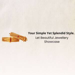 Close-up of two gold bangles with red stone detailing