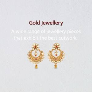 Pair of ornate gold earrings with red gemstone accents