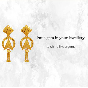 Pair of ornate golden Jhumka earrings against a textured background with text.