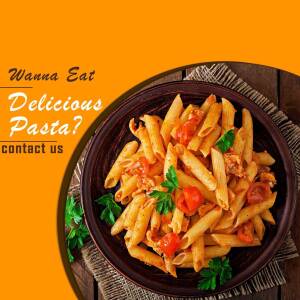 Close-up of a plate of penne pasta with tomato sauce and herbs.