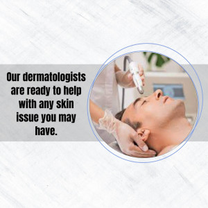 Dermatologist performing a skin treatment on a male patient.