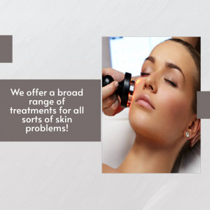 Woman receiving an LED light therapy facial treatment at a spa.