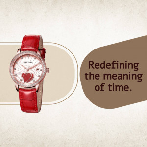 Close-up of a red watch with a heart-shaped detail on the face, set against a beige and brown background.