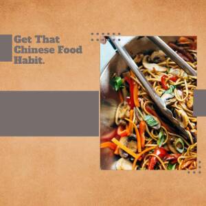 Close-up of noodles being tossed in a wok with vegetables.