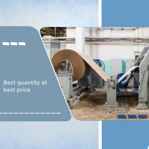 Large cardboard roll being processed on industrial machinery