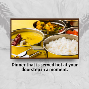 Close-up of a traditional Indian Thali meal with rice, lentils, and vegetables served in stainless steel containers.