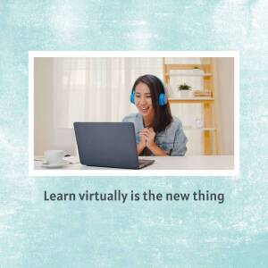 Woman wearing headphones and looking at a laptop screen while learning online.
