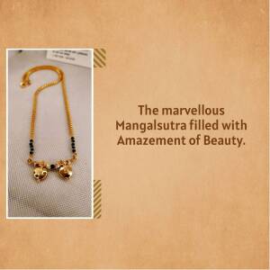 Close-up of a gold mangalsutra with black beads and heart-shaped pendants.