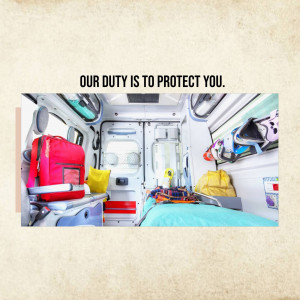 Interior view of an ambulance with medical equipment and a stretcher.