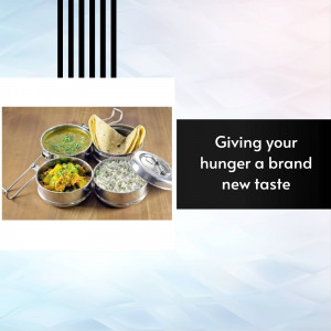 A stainless steel tiffin carrier with various Indian dishes inside.