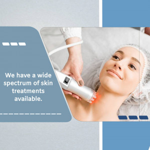 A woman receiving a facial treatment with a modern skincare device.
