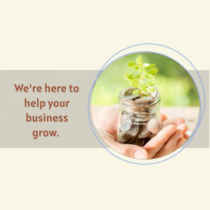 Hand holding a jar of coins with a plant growing inside, symbolizing business growth.