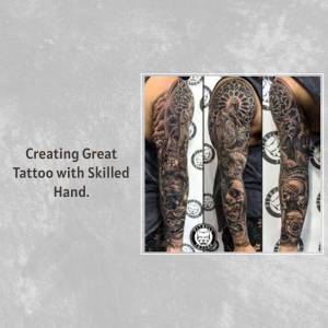 Close-up of a detailed black and grey full sleeve tattoo on a person's arm.