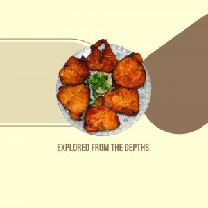 A top-down view of fried fish pieces arranged on a metal plate with a sprig of green herbs.