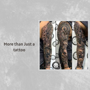 Detailed black and grey tattoo sleeve covering the entire arm