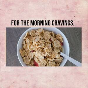 A bowl of corn flakes with strawberries and a spoon.