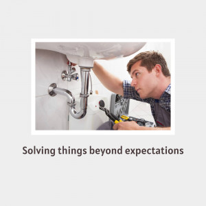 Plumber fixing a sink drain