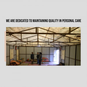 Interior view of a temporary shelter with people inside.