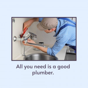Plumber repairing a faucet under a kitchen sink