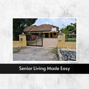 Exterior view of a senior living facility with a gated entrance.