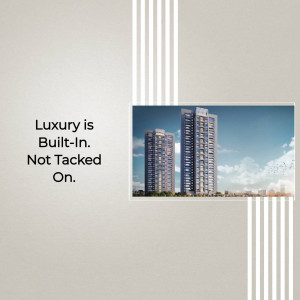 Modern high-rise residential buildings with a tagline 'Luxury is Built-In. Not Tacked On.'