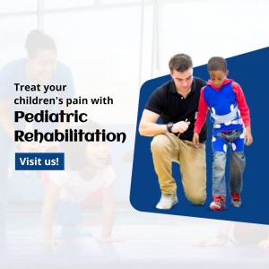 A physical therapist working with a young boy in a rehabilitation setting.
