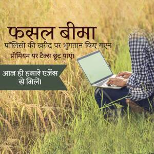 Farmer using a laptop in a wheat field to access crop insurance information.