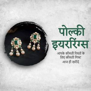 Close-up of elegant Polki earrings with emeralds and pearls against a dark background.