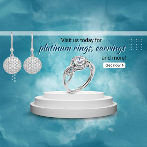 Close-up of platinum earrings and ring on a white pedestal