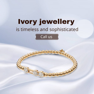 Gold bracelet with diamond accents on a silk background