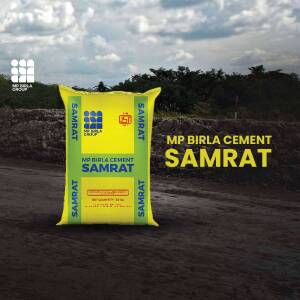A yellow bag of MP Birla Samrat Cement with the company logo and branding.