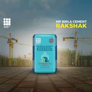 MP Birla Rakshak Cement bag with construction site background