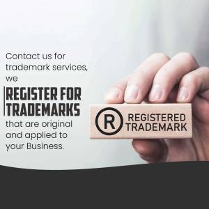 Hand holding wooden blocks with trademark registration message