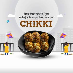 Close-up of Chikki (Indian Peanut Brittle) with kites in the background