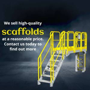 Image of a yellow and silver metal scaffold with stairs against a dark background.