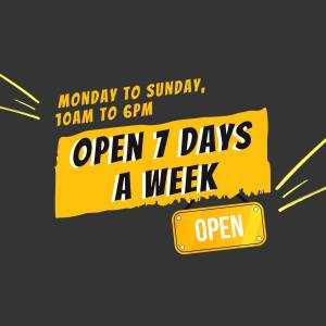 Yellow sign with text 'Open 7 Days a Week' and business hours.