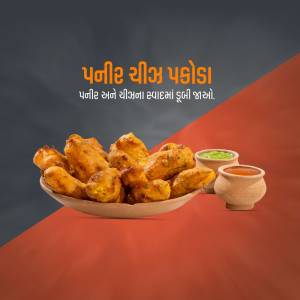 A plate of golden-brown Paneer Chilli Pakoda with a side of green chutney.