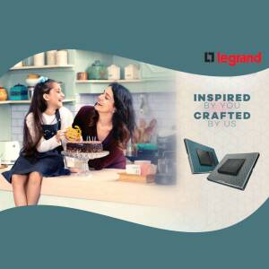 Mother and daughter decorating a cake with Legrand smart home products in the background.