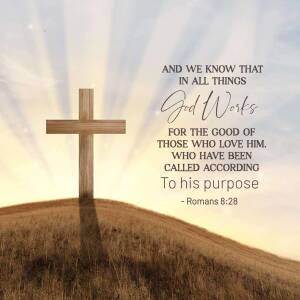 A wooden cross silhouetted against a sunset with the text 'And we know that in all things God Works for the good of those who love Him'