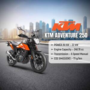 Orange and black KTM Adventure 250 motorcycle parked on a road with a city skyline in the background.
