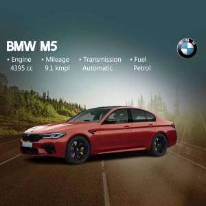 Red BMW M5 car on a road with specifications listed