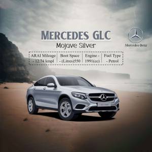 Silver Mercedes GLC SUV parked on a beach with vehicle specifications displayed