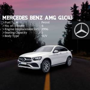 White Mercedes-Benz GLC43 AMG coupe SUV on a road with vehicle specifications displayed.