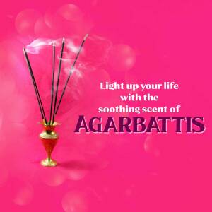 Close-up of burning agarbatti sticks in a decorative holder against a pink bokeh background.