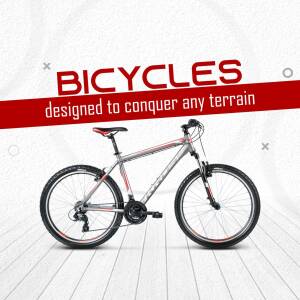 Mountain bike against a white wooden background with text 'Bicycles designed to conquer any terrain'