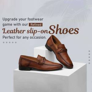 Brown leather slip-on shoes on a white pedestal