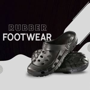 Close-up of black rubber clogs with the text 'Rubber Footwear'
