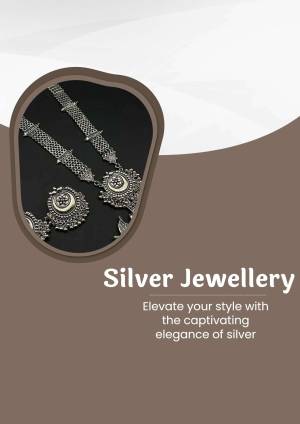 Close-up of intricate silver necklaces and bracelets on a brown background
