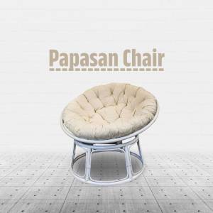 A beige Papasan chair with a white frame on a tiled floor.